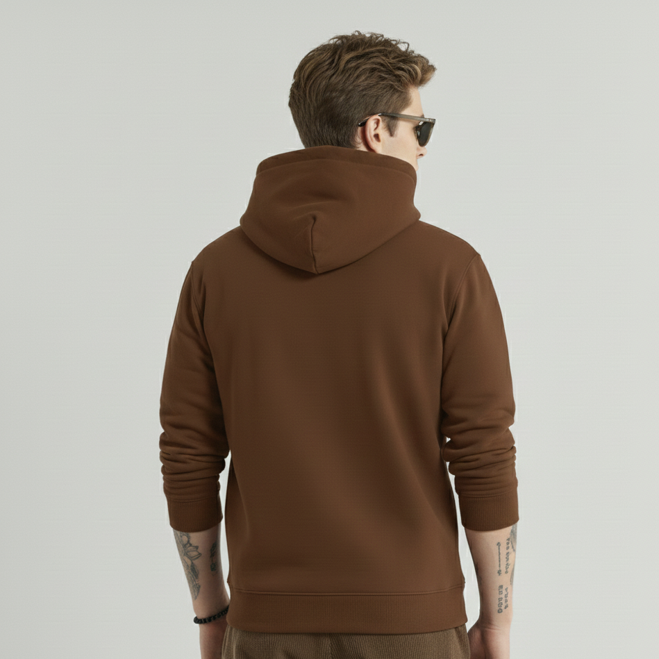 Man wearing a brown hoodie from behind on a light gray background