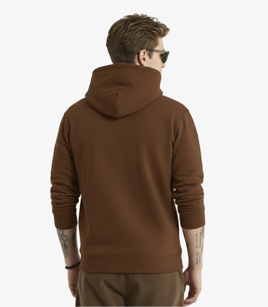 Man wearing a brown hoodie from behind on a light gray background