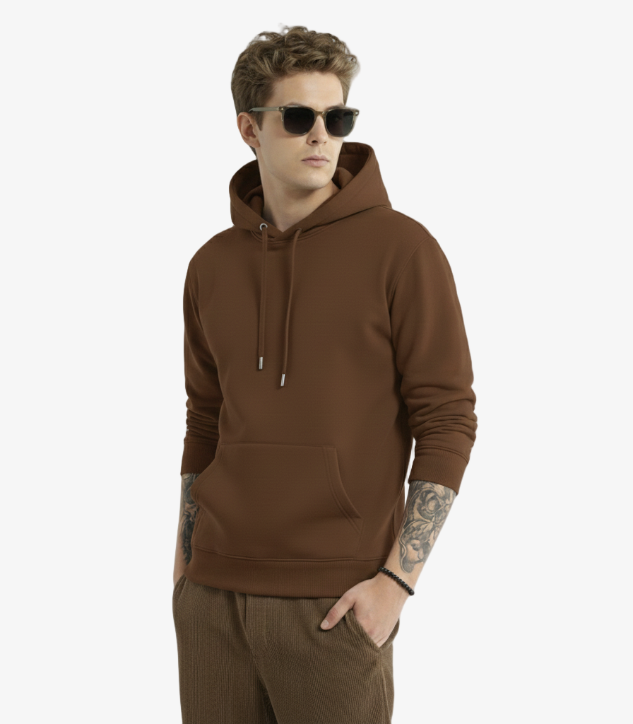 Man wearing a brown hoodie and sunglasses on a light gray background