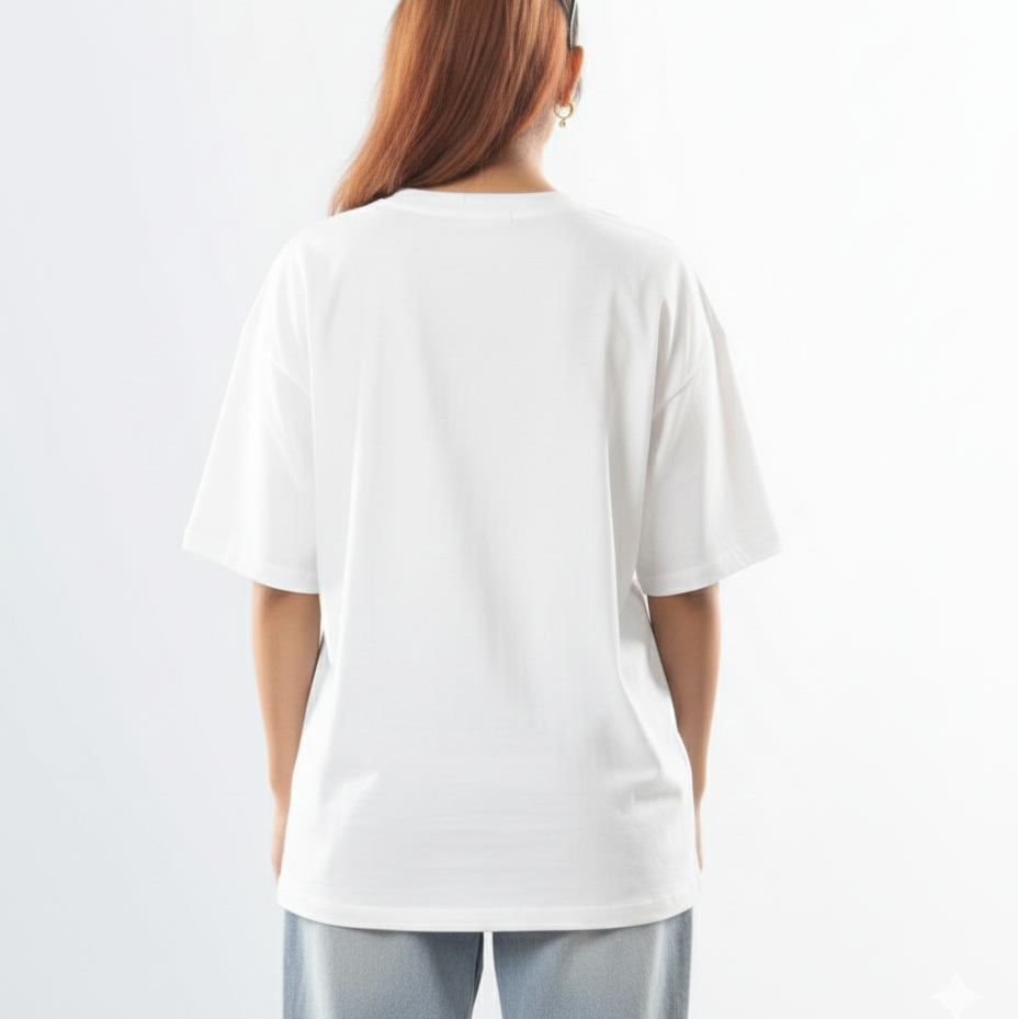 Person wearing a plain white t-shirt on a light gray background