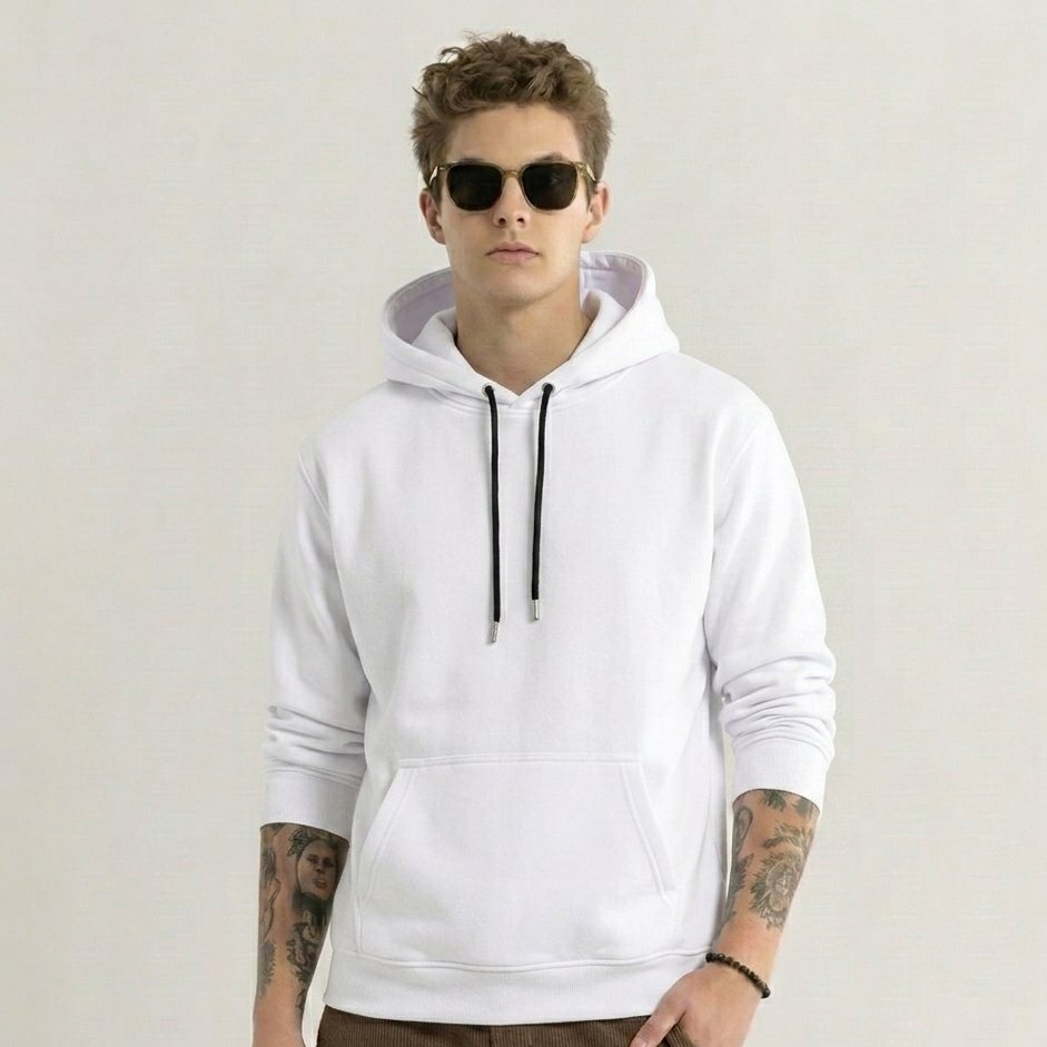 Person wearing a white hoodie with a plain background