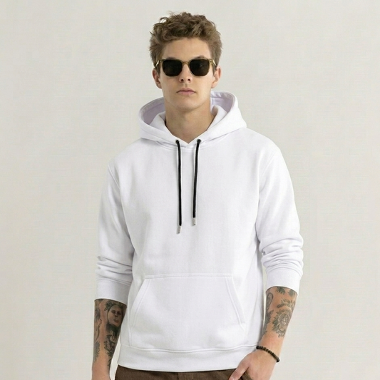 Person wearing a white hoodie with a plain background