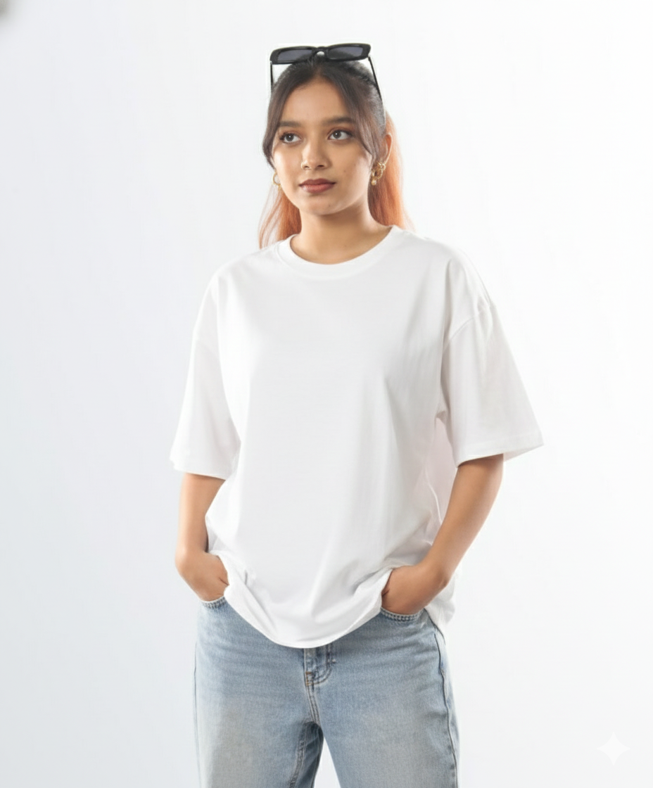 Person wearing a white t-shirt and light blue jeans against a plain background