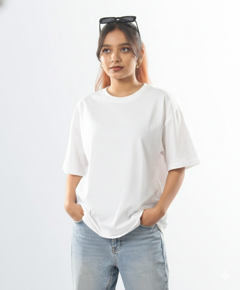 Person wearing a white t-shirt and light blue jeans against a plain background