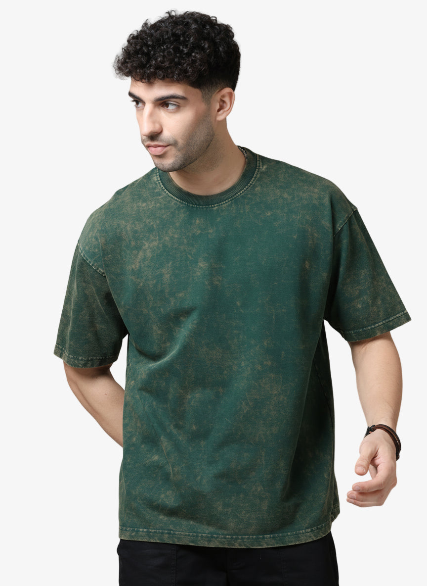 Man wearing a green t-shirt against a white background