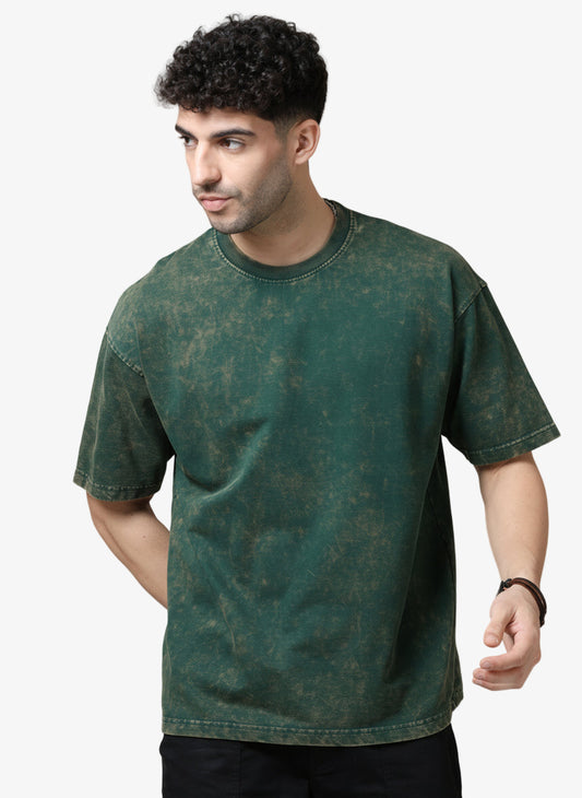 Man wearing a green t-shirt against a white background